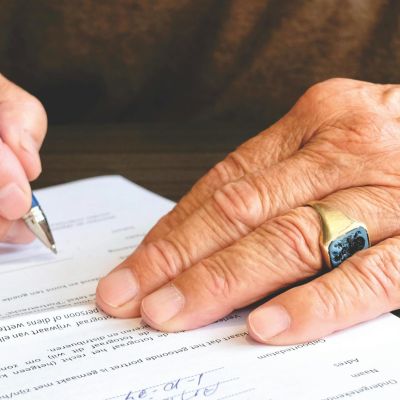 person-signing-document-paper-618158
